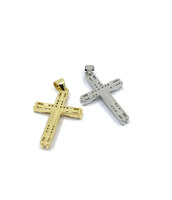 Back side of gold, silver cross pendant