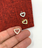 Heart charm on hand for size reference