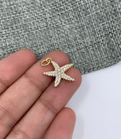 Starfish pendant on hand for size reference