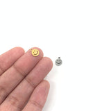 Smiley face shown on hand for size reference