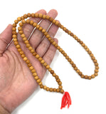 6mm Sandalwood Mala Bead on hand for size reference
