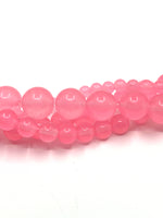 Pink Jade Beads in strands twisted onto each other