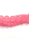 Pink Jade Beads in strands twisted onto each other