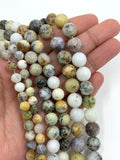 White opal beads on hand for size reference