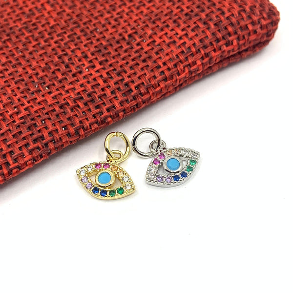 Gold and silver pave evil eye charm with multi colored stones