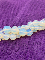 Faceted Opalite Beads twisted onto each other 